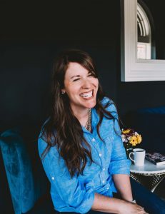 Woman laughing and smiling for camera